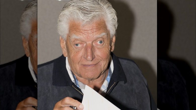 David Prowse signing paper